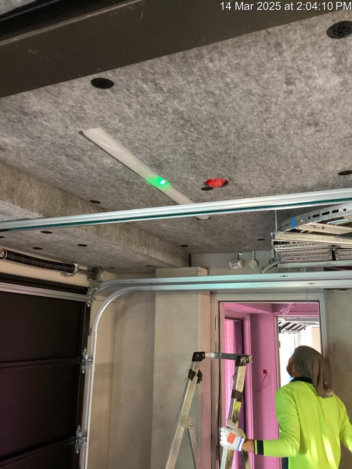 Insulation panels fixed to a residential carpark soffit beneath occupied floors